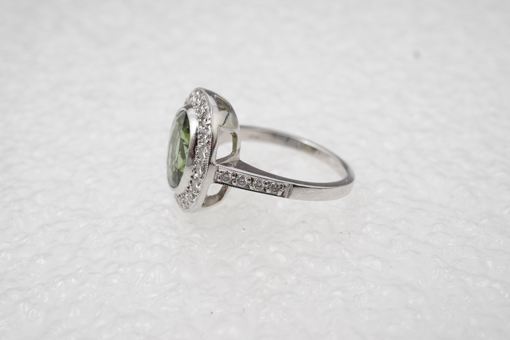 A green tourmaline and diamond cluster ring